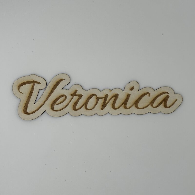 Veronica: a script name engraved and cut out of basswood